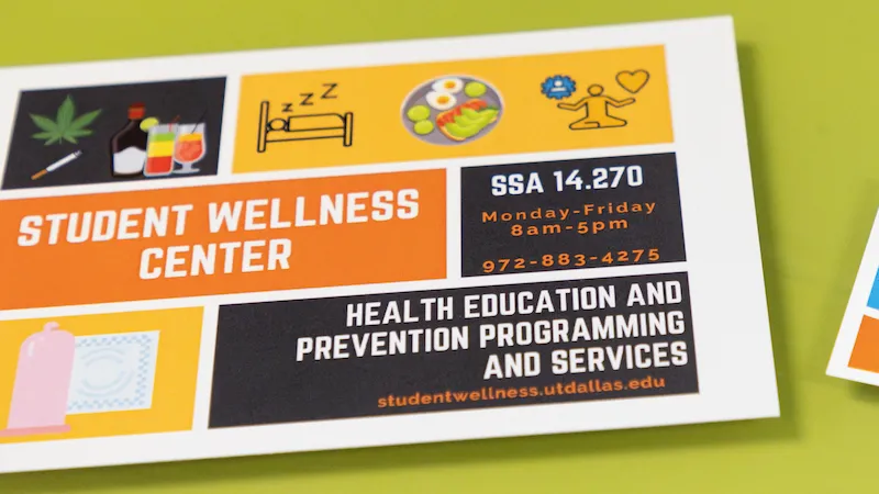 A printed information card for the Student Wellness Center at UT Dallas