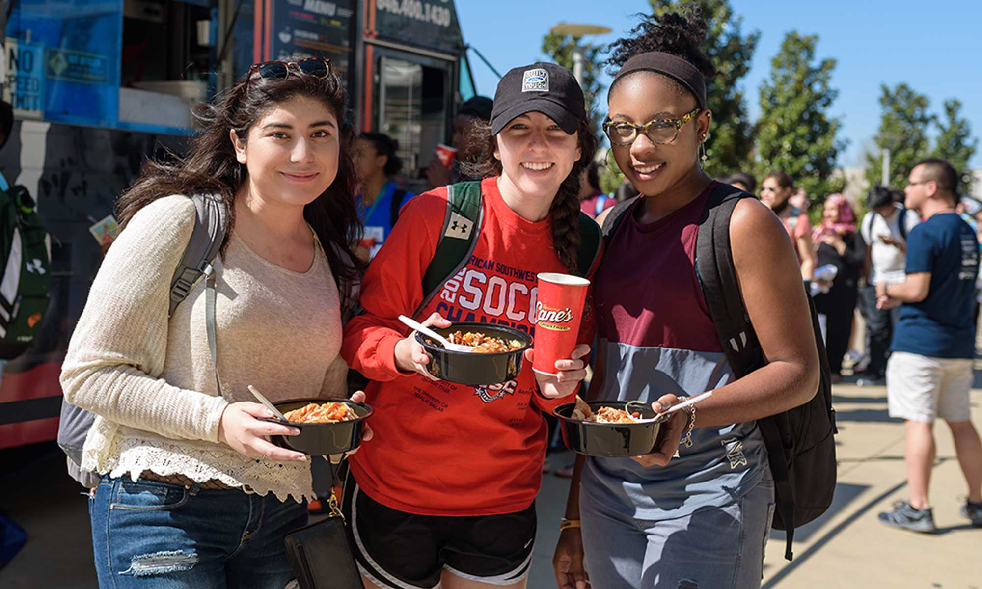 Photo of students holding fast food